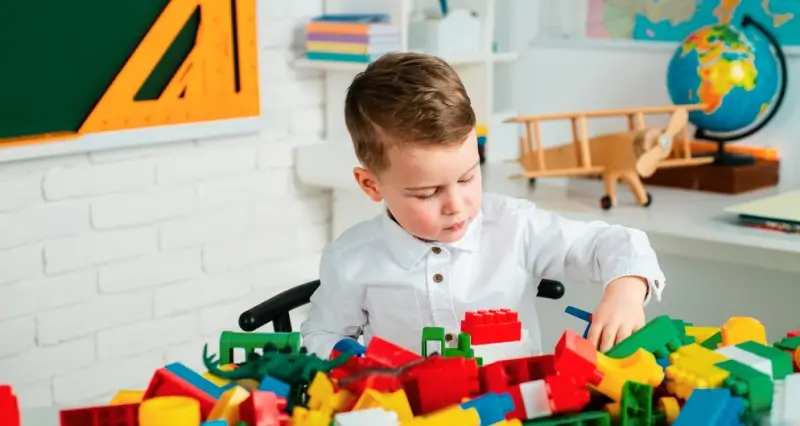 Child playing with learning toys such as puzzles and building blocks to support education